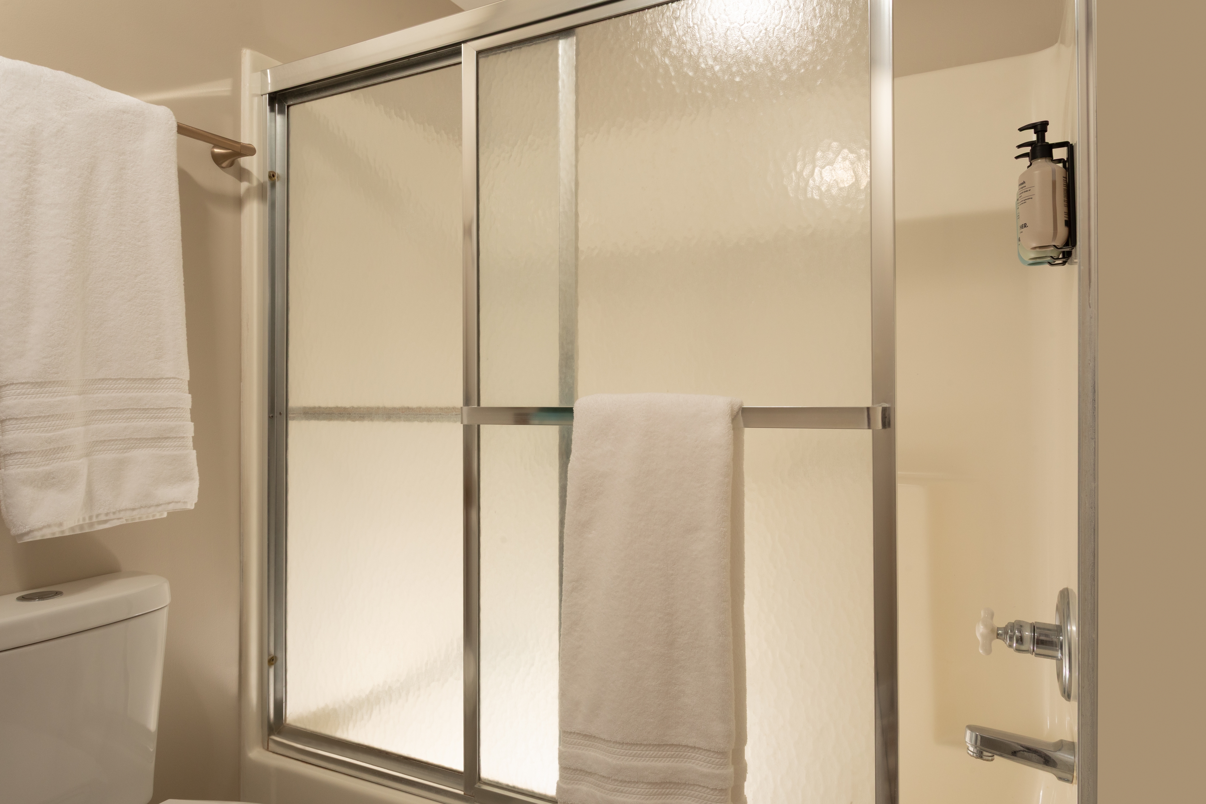 Private bathroom with tub shower combo