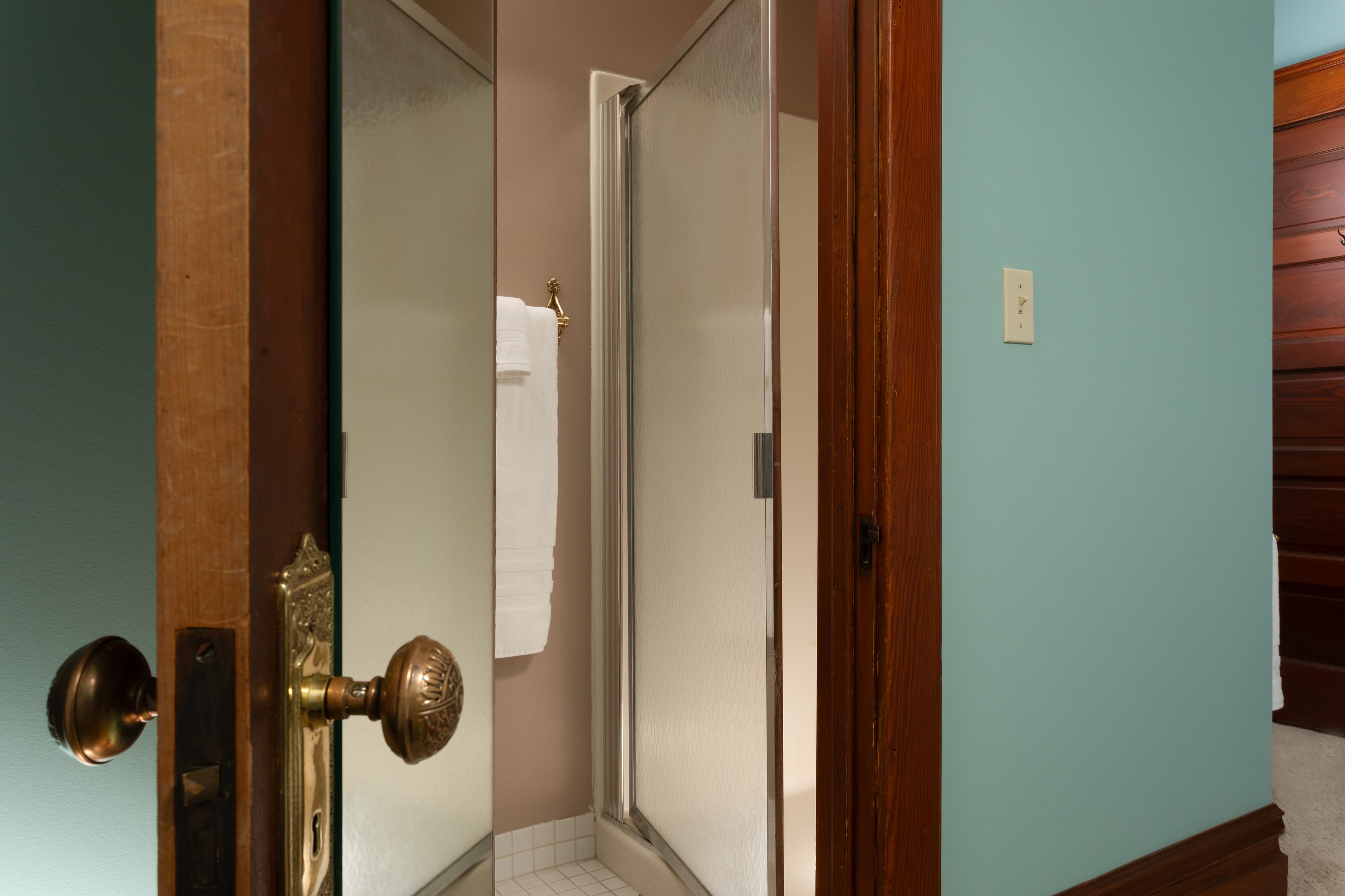 Private bathroom entrance and stand up shower