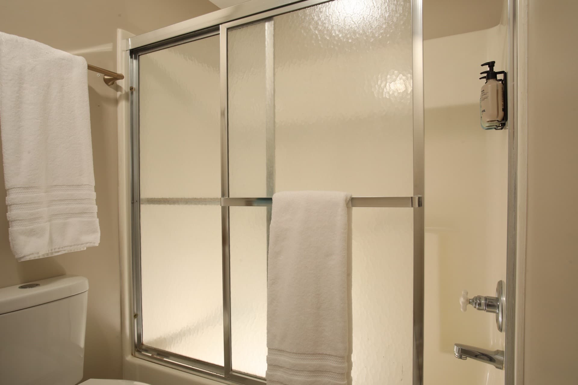Private bathroom with tub shower combo