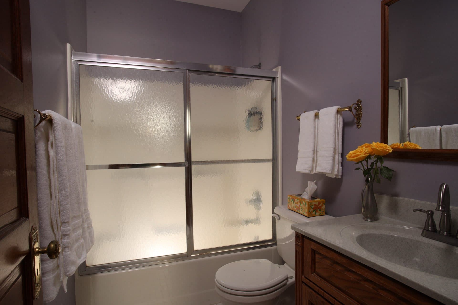 Private bathroom with tub shower combo