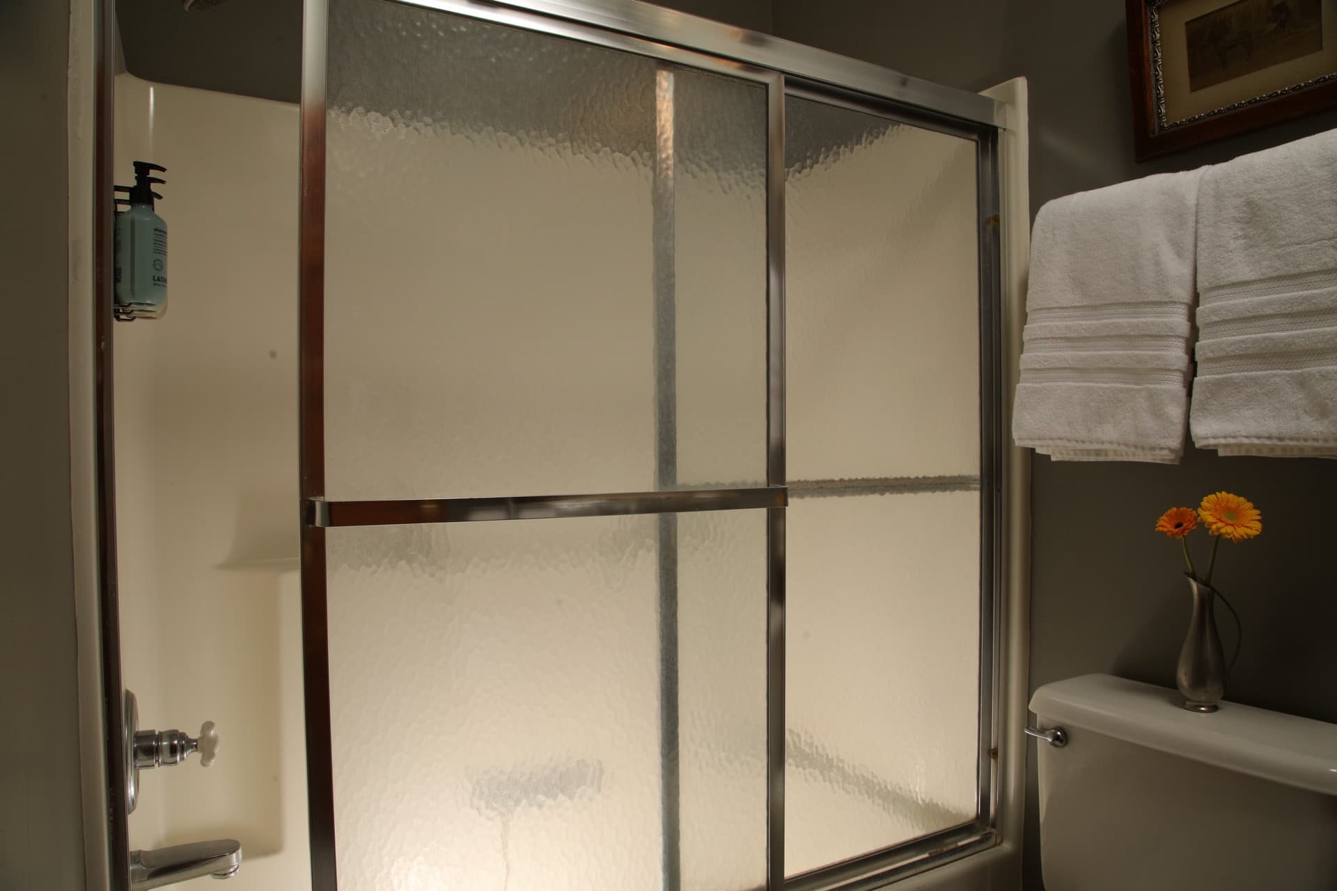 Private bathroom with combo tub/ shower combo